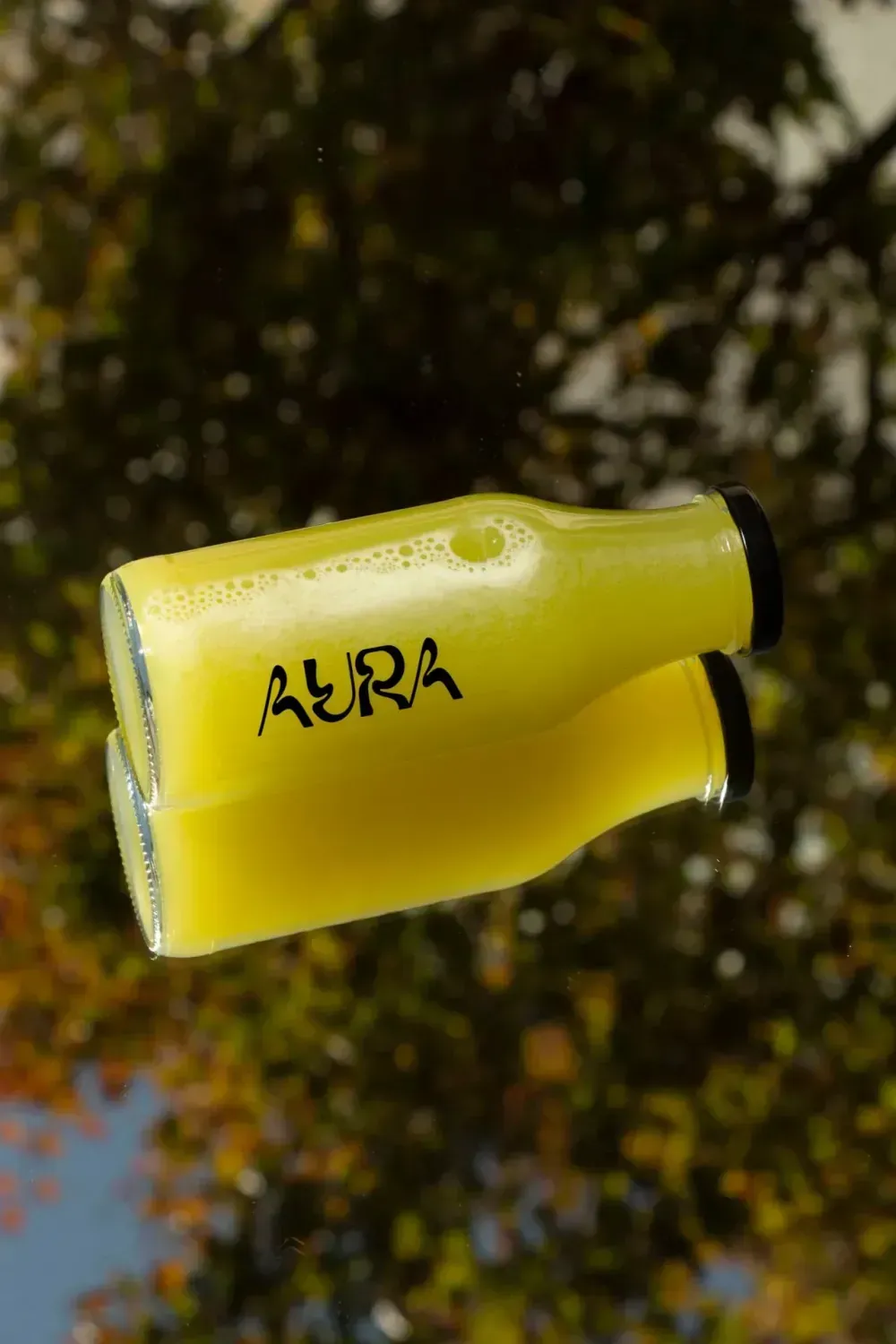Cold-pressed juices and wellness shots at Aura's juice bar in Lisbon